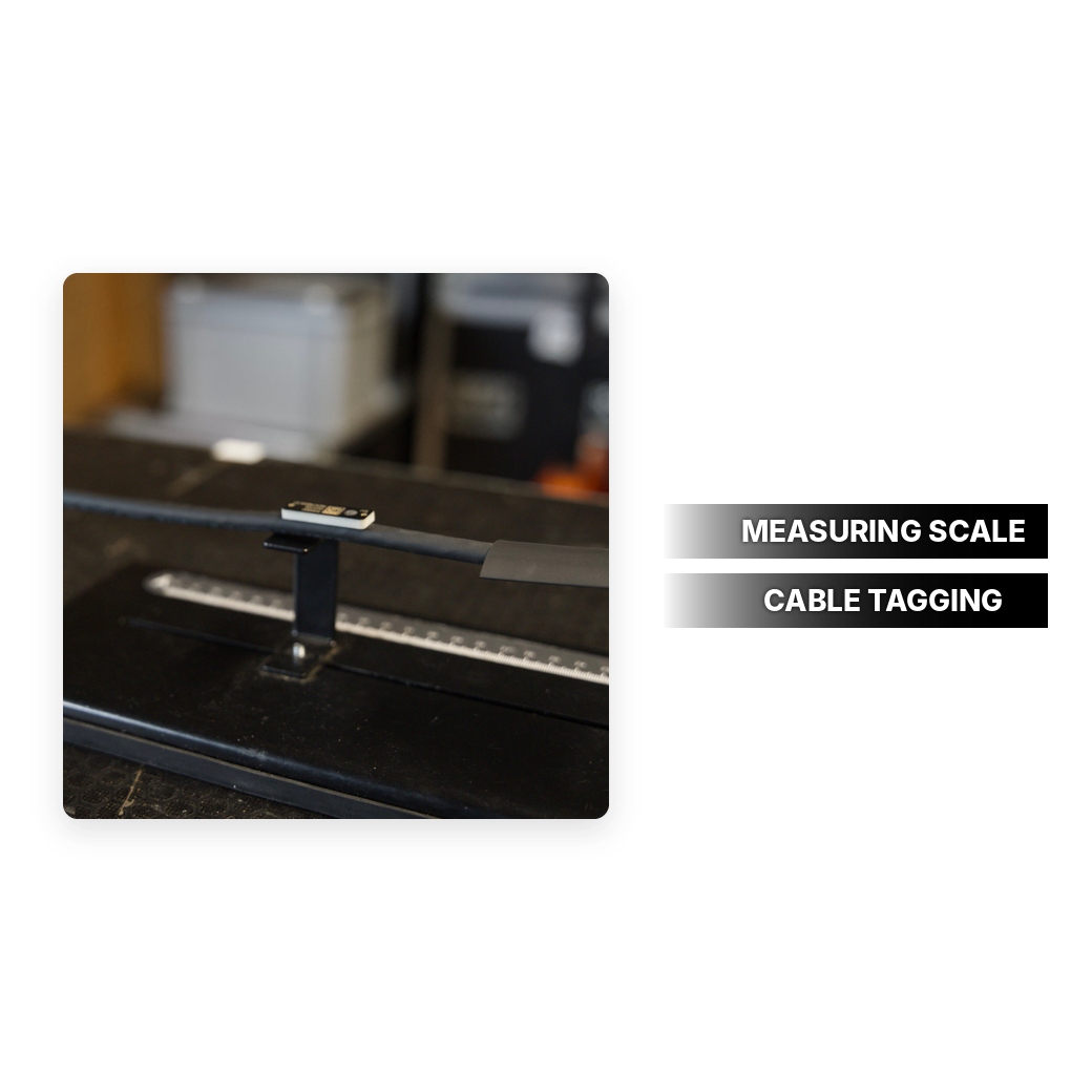 Tag positioning tool with measuring scale for tagging cables